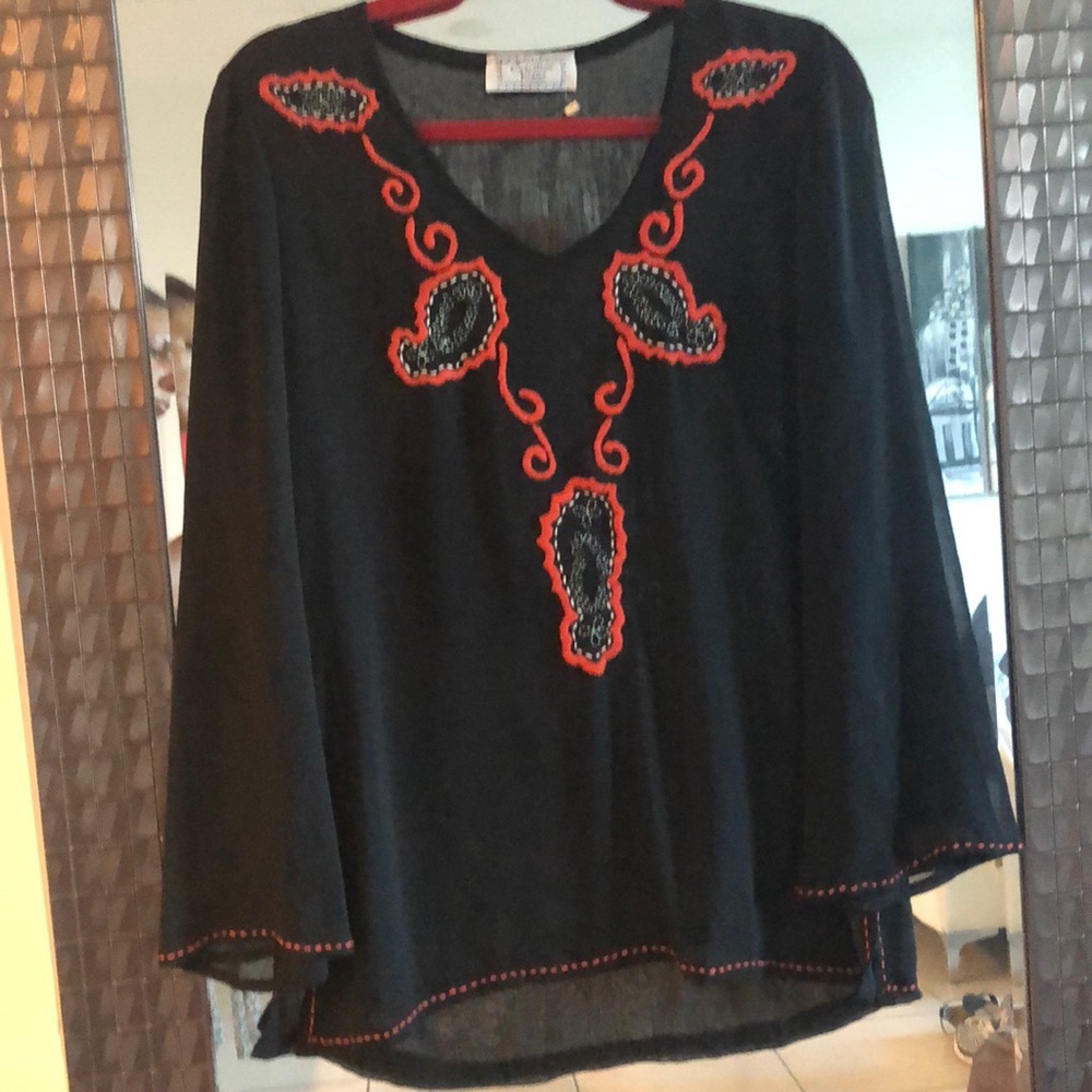 Gorgeous blouse with hand-made design.